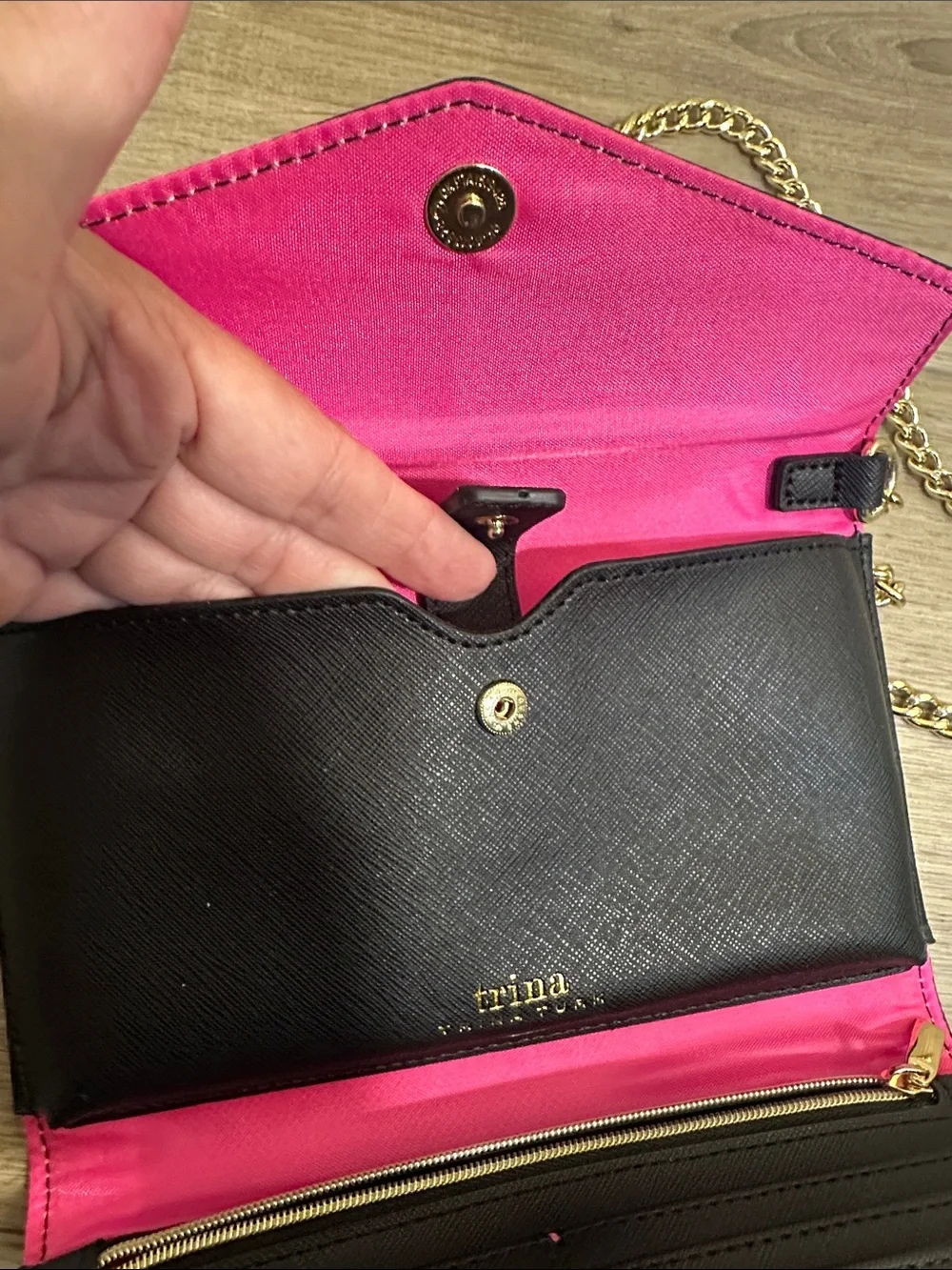 Trina Turk pink, red, black and blue cross body clutch with gold tone chain